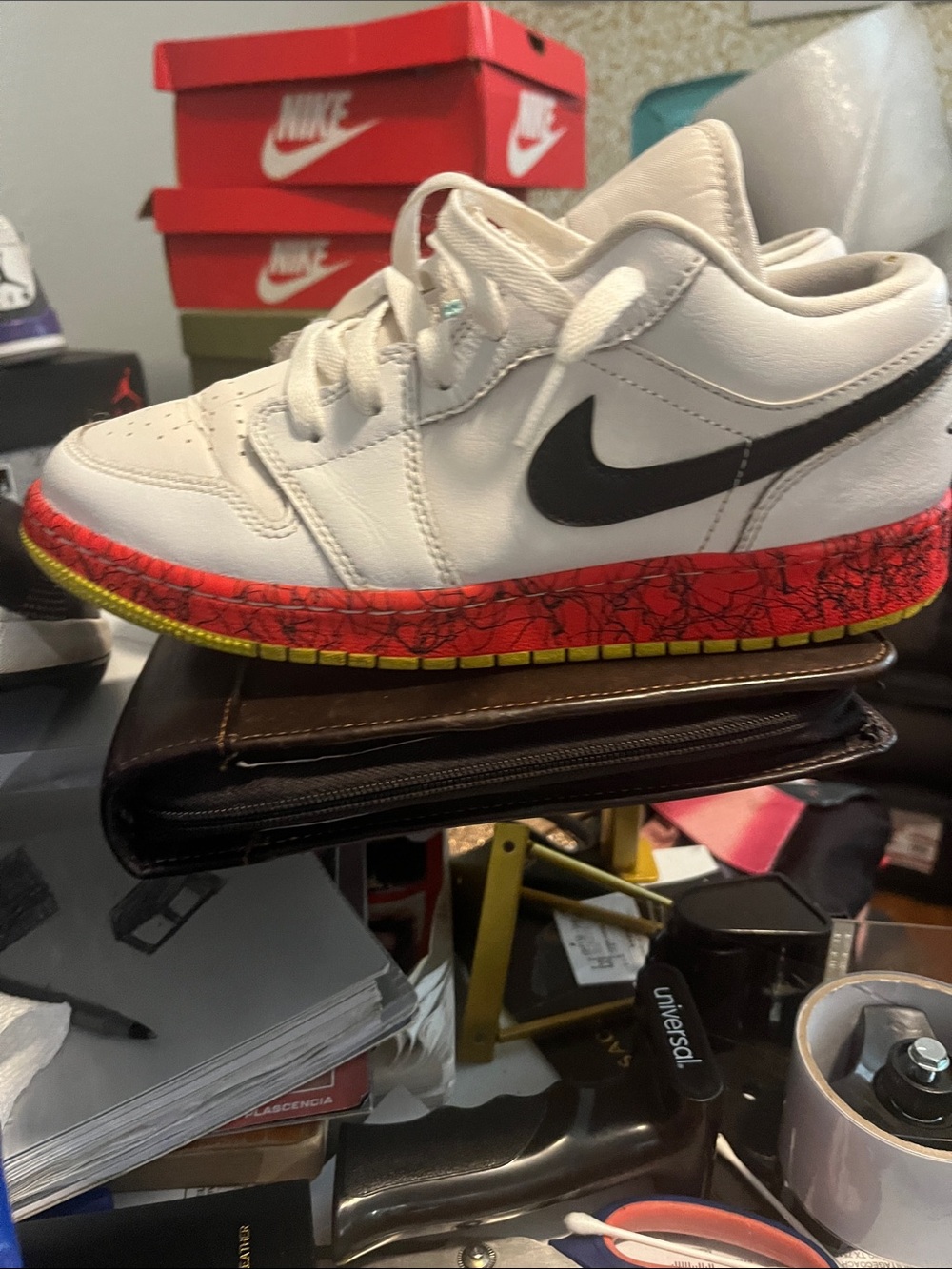 Nike Kids White Leather Sneakers with Black Swoosh and Red-Yellow Accent Midsole
